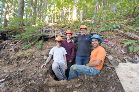 soil sampling crew standing in a soil pit