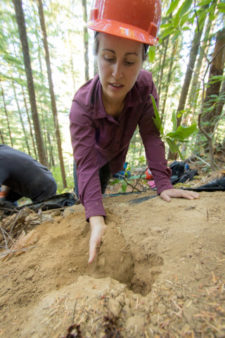 Karla Jarecke carefully filling voids of a soil pit and trying to mimic the previous bulk density of the soil prior to excavation