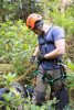 Stephen Calkins prepares his climbing harness