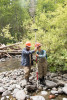 (L to R) Alberto Paredes, visiting researcher from Universidad Austral de Chile, Valdivia, Chile, and Arianna Goodman, graduate student OSU, holding a Real Time Kinematic (RTK) GPS receiver to make precise measurements of positions in the stream